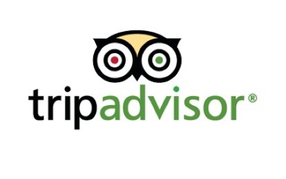 Tripadvisor logo featuring a stylized owl face with red and green eyes above the text "tripadvisor" in black and green letters on a white background.